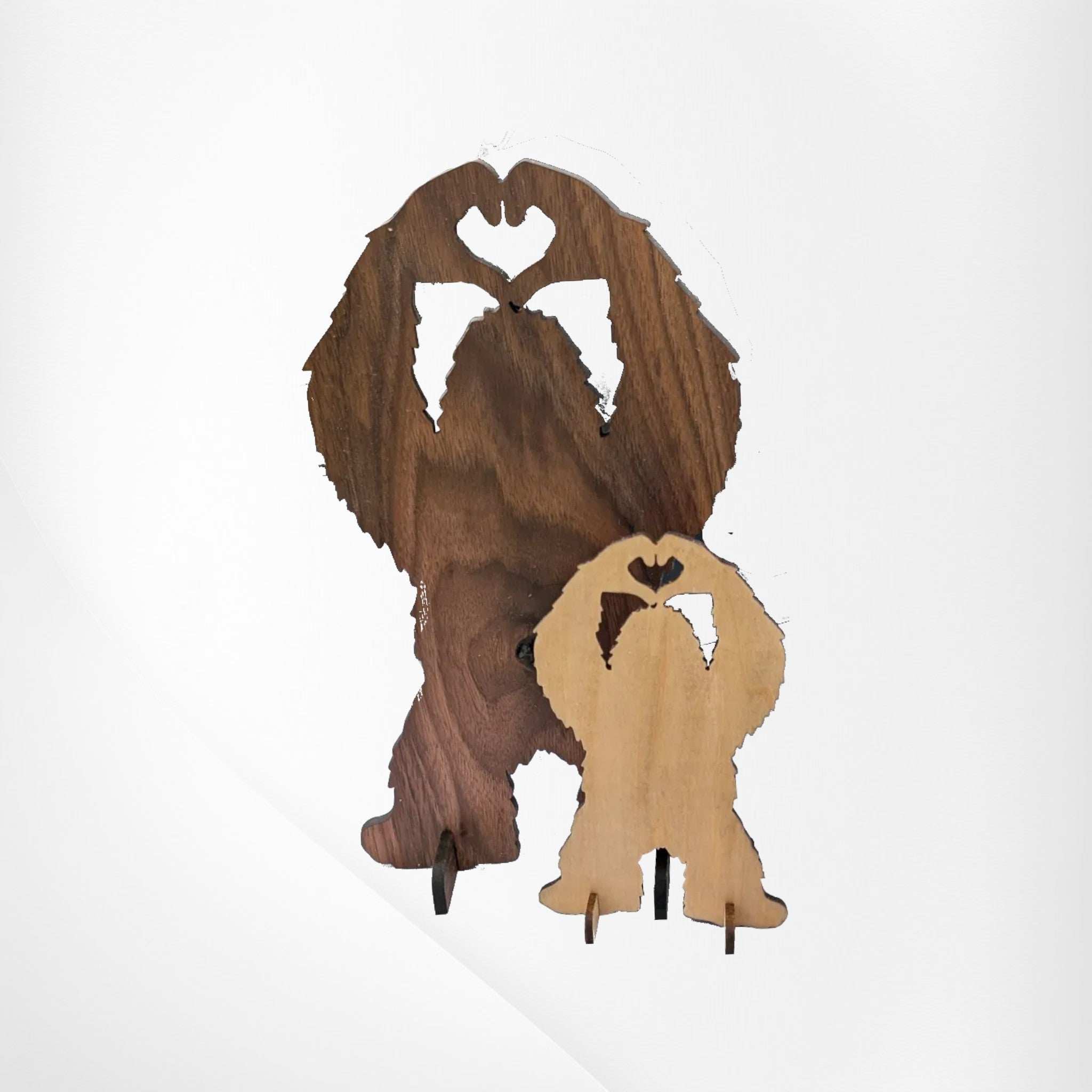 Dogman's Designs Bigfoot silhouette wooden desk stand with heart hands, available in walnut and light wood.
