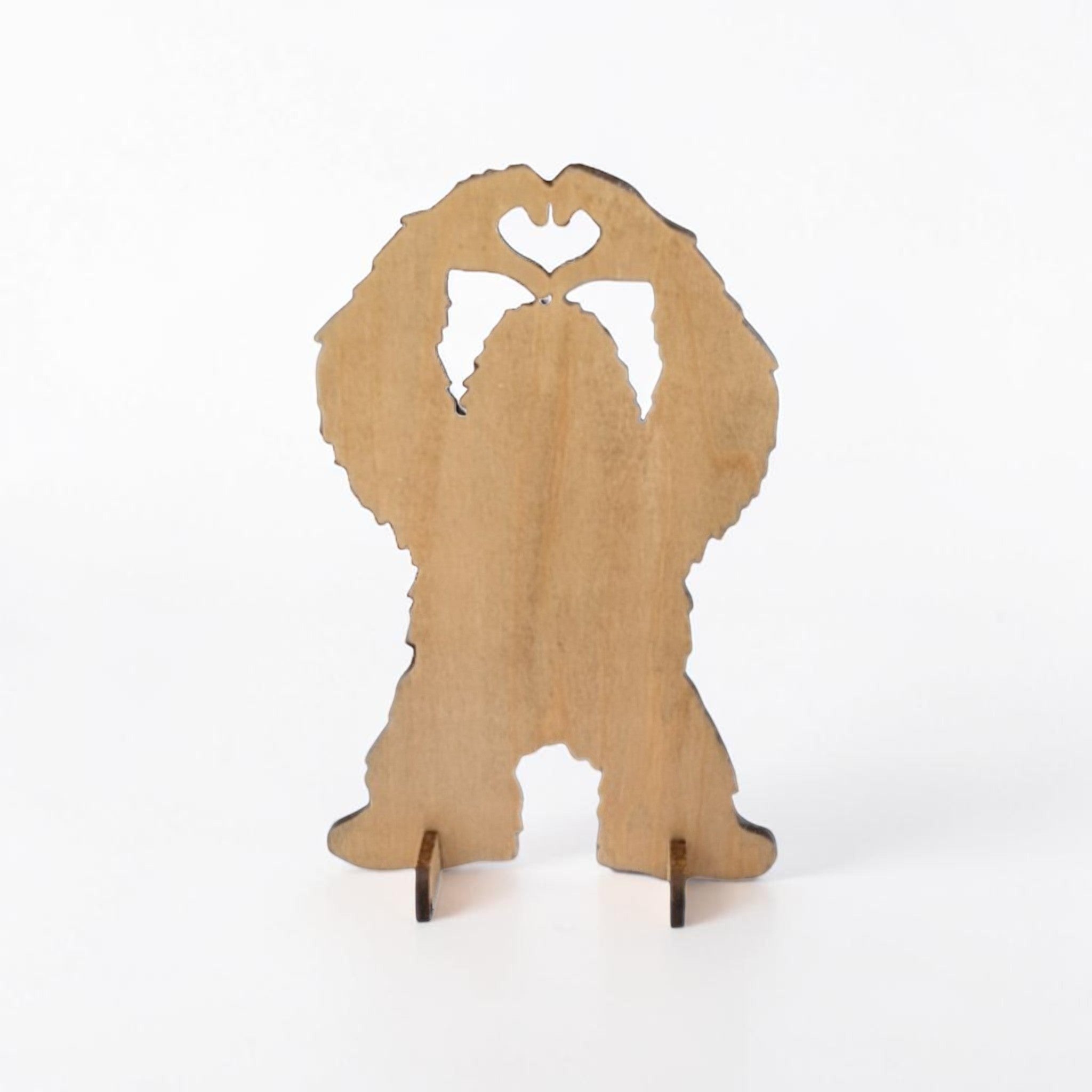 Dogman's Designs Bigfoot silhouette wooden desk stand with heart hands. Available in walnut and light wood.